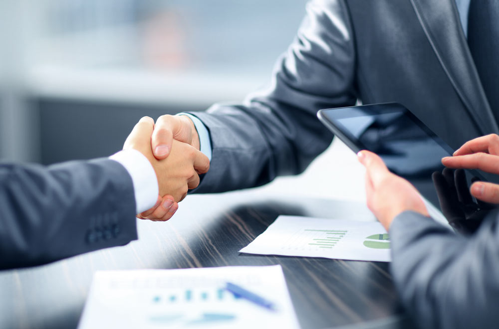 Business deal with people shaking hands