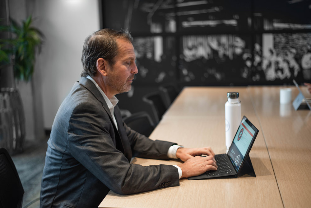 Jaco employee working on laptop