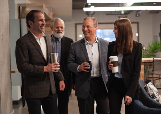 JACO Advisory Group team members collaborating on strategic planning and business development solutions for middle-market companies